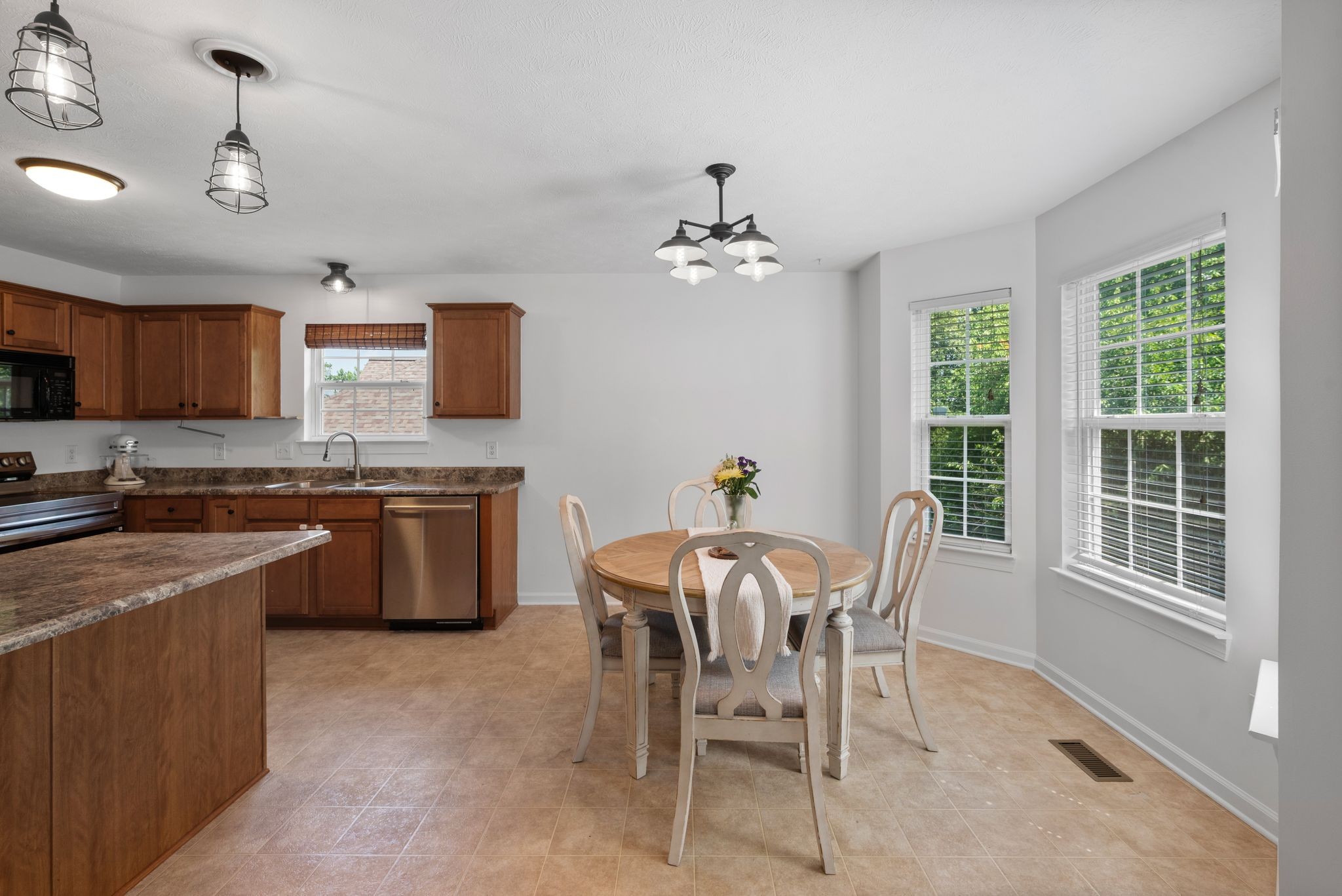 4223 Birmingham Road Lebanon, TN 37090 - Photo 8 of 30 a kitchen with a table chairs sink and cabinets