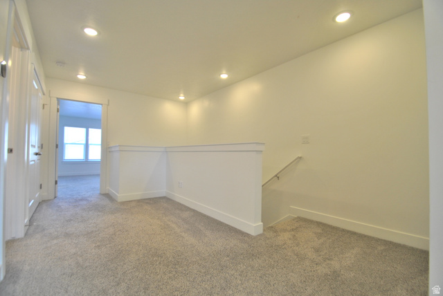 1219 West 1870 South Logan, UT 84321 - Photo 6 of 18 Carpeted loft space featuring recessed lighting, carpeted floors, and access to the bedrooms, laundry, and guest bathroom