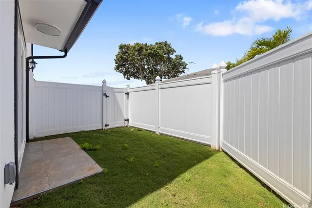 a backyard of a house with lots of green space