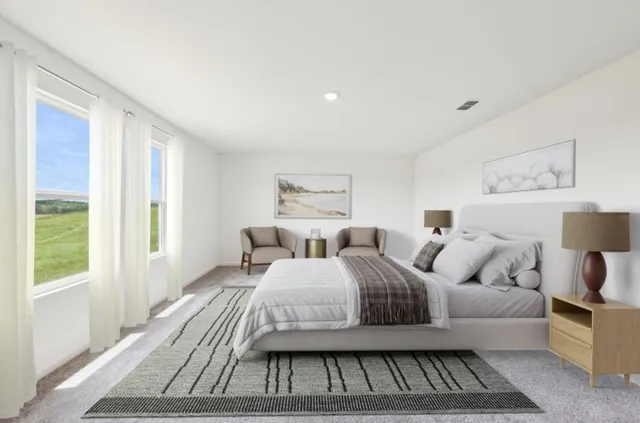 a bedroom with a bed a mirror and a window