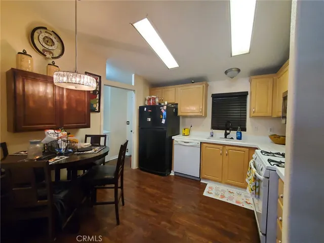 a kitchen with stainless steel appliances a stove microwave and a refrigerator