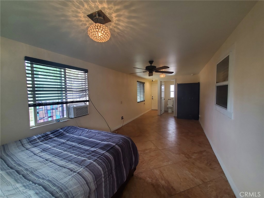 29021 Bouquet Canyon Road, Unit 317 Saugus, CA 91350 - Photo 15 of 24 a bedroom with a large bed and a window