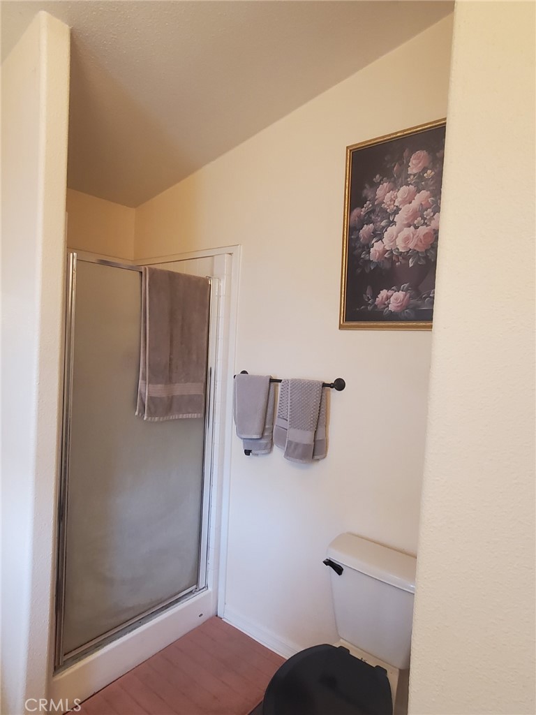 29021 Bouquet Canyon Road, Unit 317 Saugus, CA 91350 - Photo 24 of 24 a bathroom with a bathtub and a shower