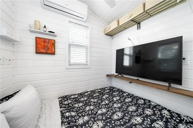 a bathroom with a bathtub and a window