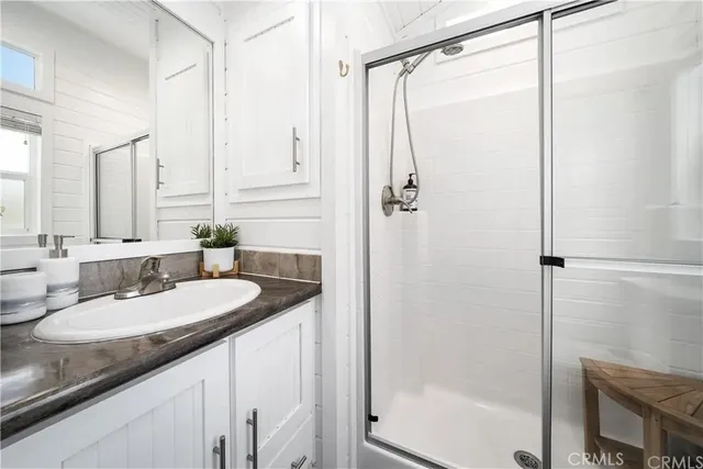 a white toilet sitting next to a bathroom