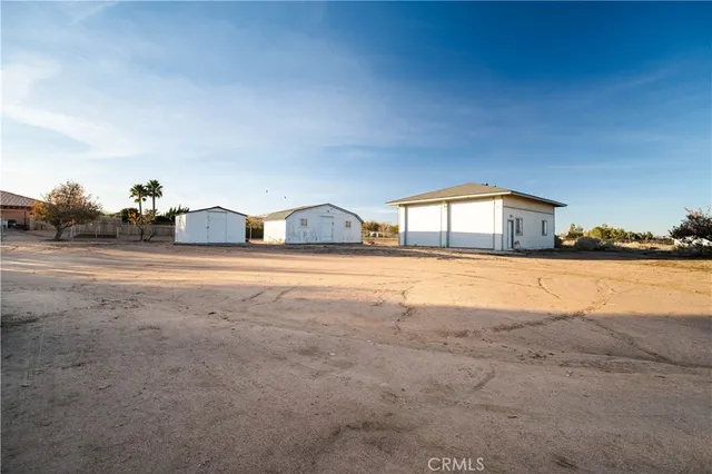 a view of house with yard