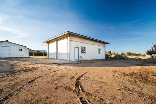 a view of a house with a snow in the background