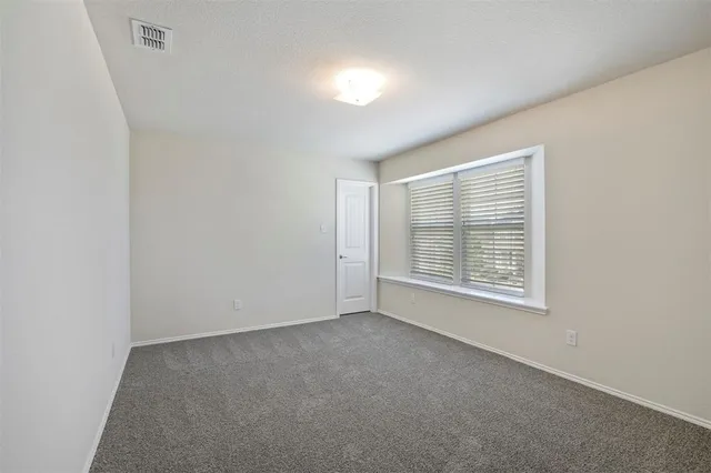 a bathroom with a sink toilet vanity and shower