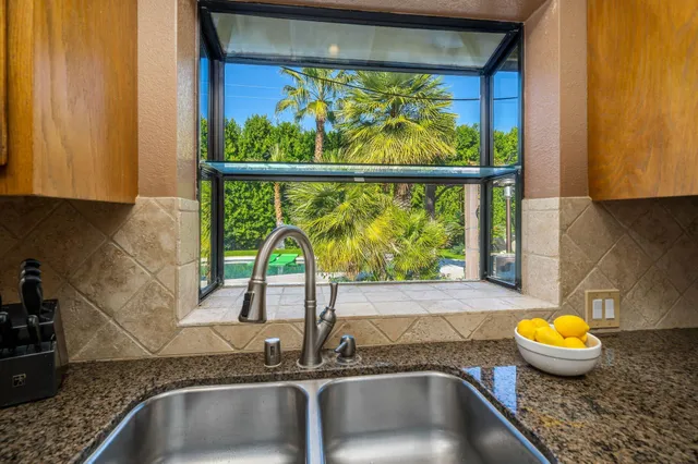a kitchen with a sink and a window