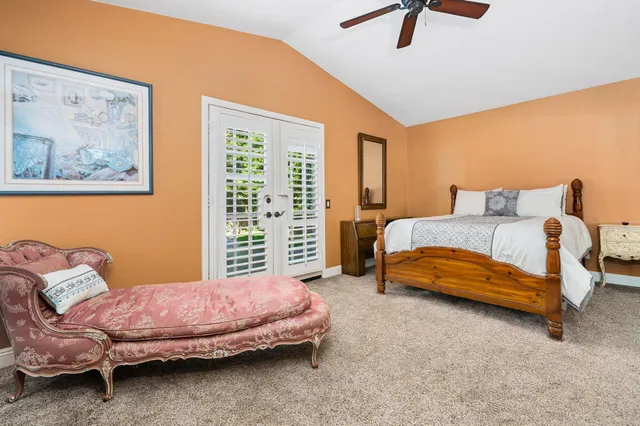 a bedroom with a bed and a couch