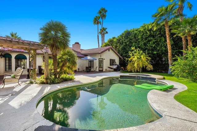 a view of a house with swimming pool