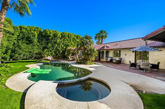 a view of a swimming pool with a patio