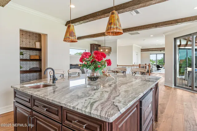 a living room with furniture and a floor to ceiling window