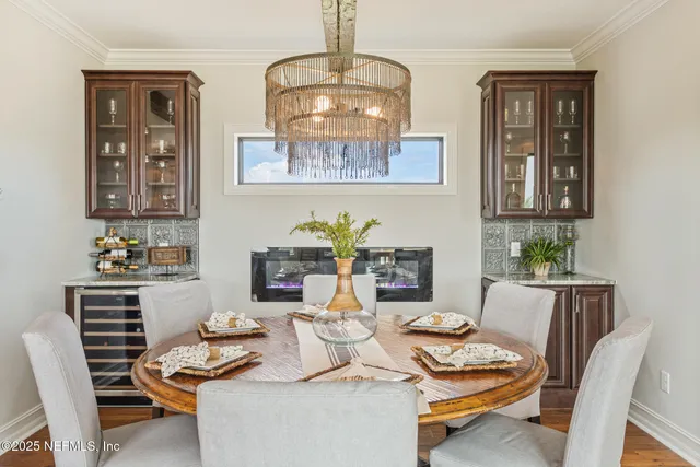 a kitchen with granite countertop white cabinets and a sink