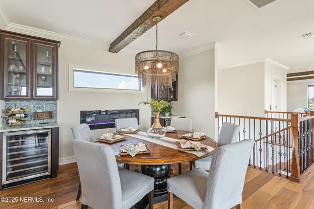 a bedroom with a large bed couch and a window