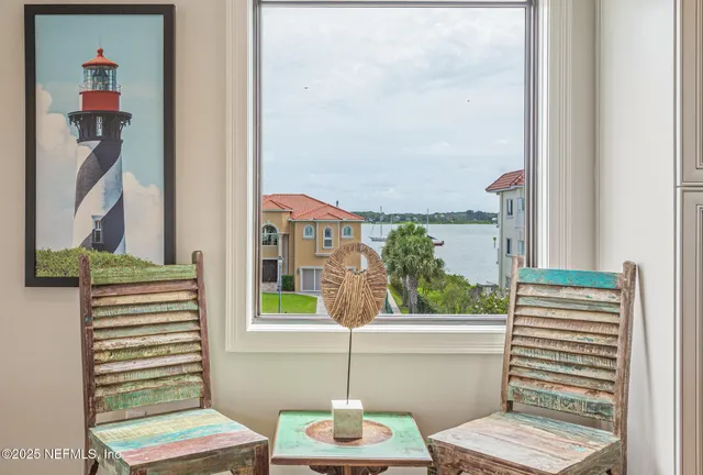 a bathroom with double vanity sinks a mirror and a shower