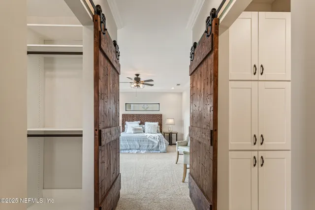 a front view of a house with a yard and a garage