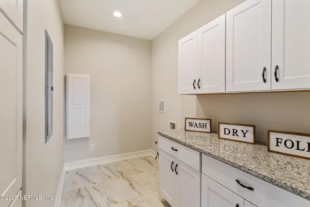 a view of balcony with a couple of chairs