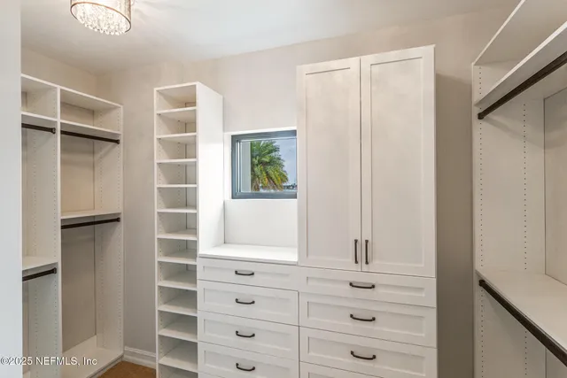 a view of a swimming pool with chairs