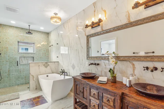 a swimming pool with outdoor seating and plants