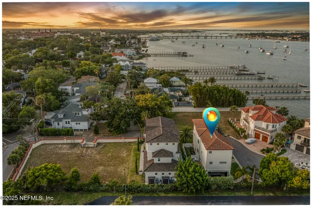 a front view of a house with a yard and a garage