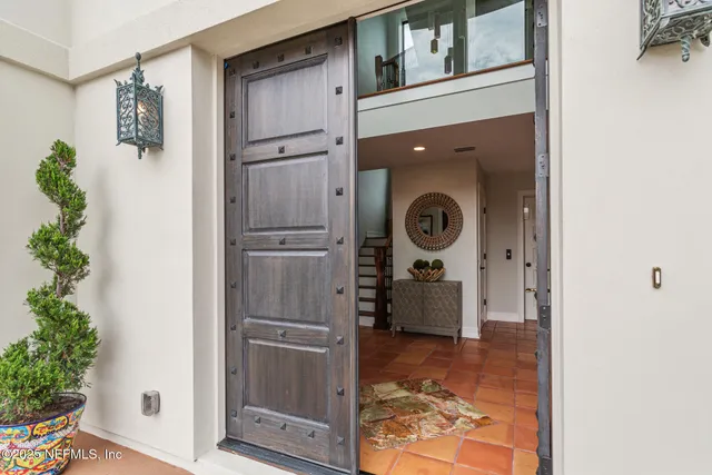 a kitchen with a table and chairs