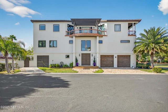 a kitchen with kitchen island a stove a sink and a refrigerator