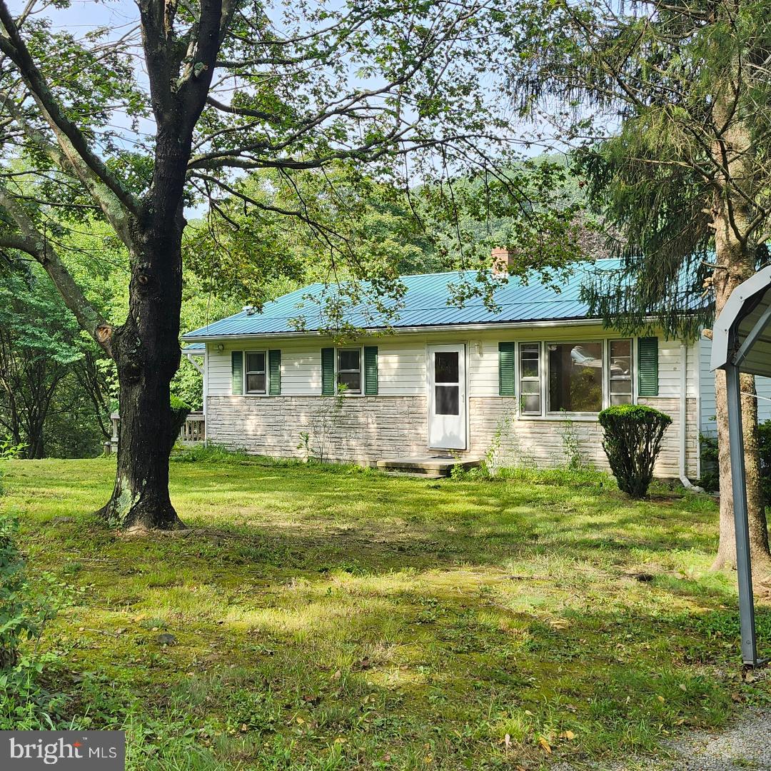 2445 Bear Wallow Hollow Road Augusta, WV 26704 - Photo 1 of 22 a view of a house with a backyard