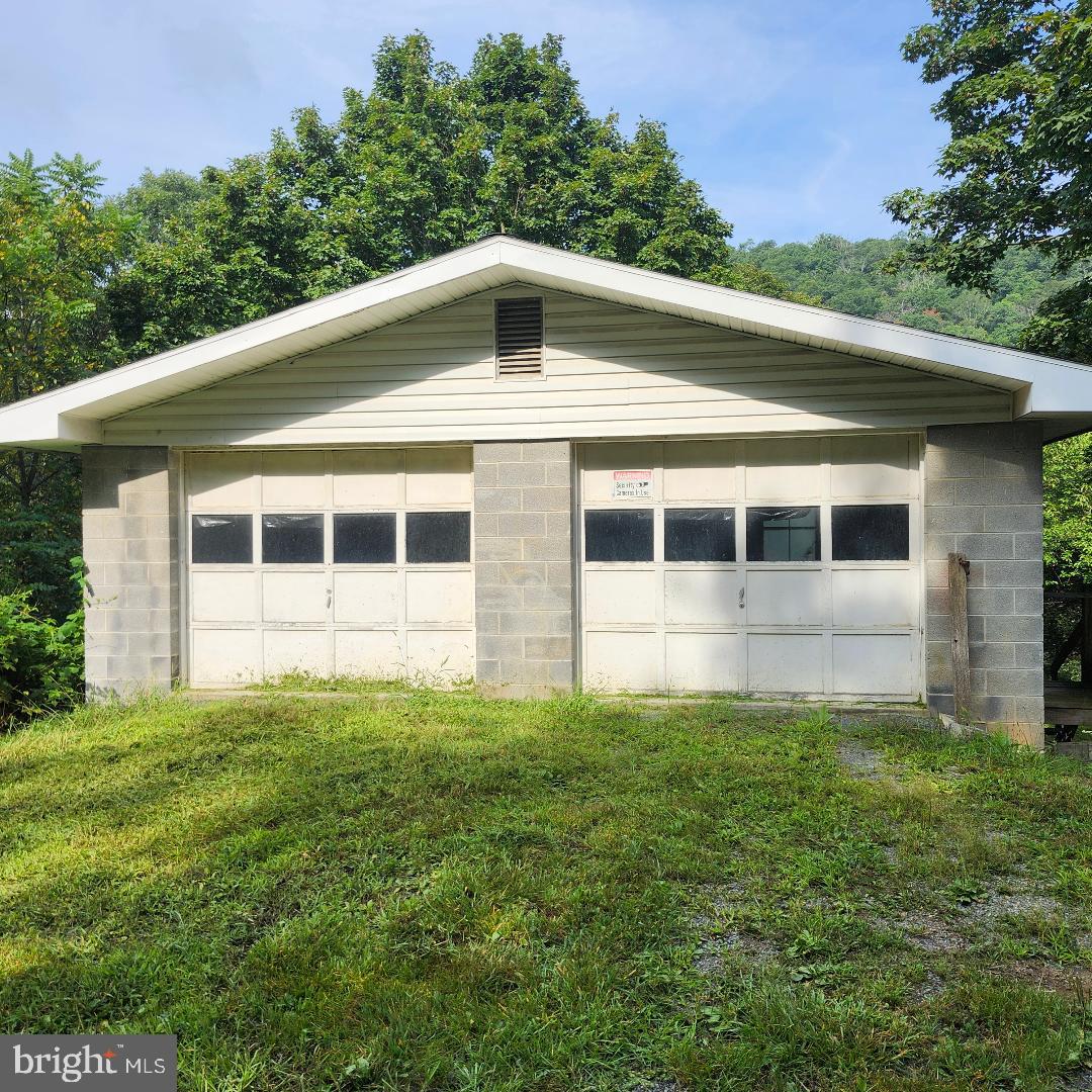 2445 Bear Wallow Hollow Road Augusta, WV 26704 - Photo 15 of 22 a big white house with a yard
