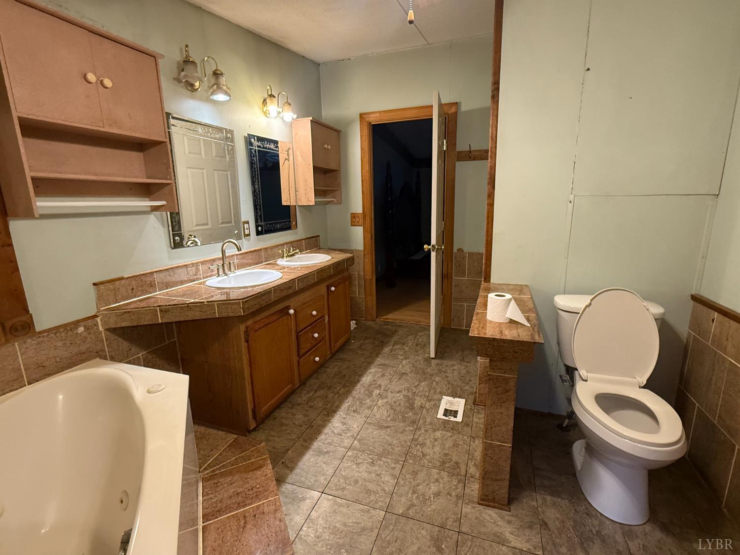 3974 Germantown Road Keysville, VA 23947 - Photo 12 of 42 a bathroom with a toilet sink and mirror