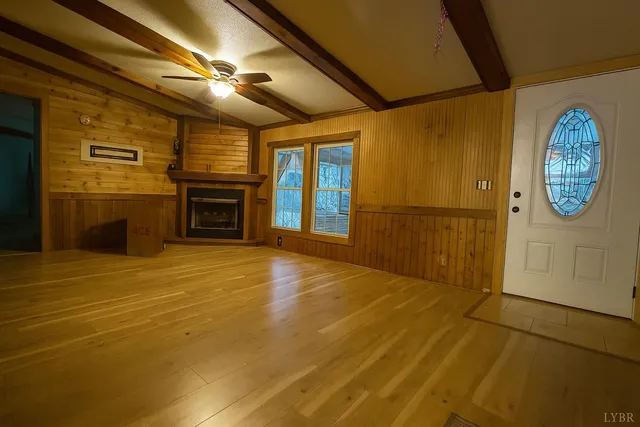 a view of a livingroom with an empty space and a fireplace
