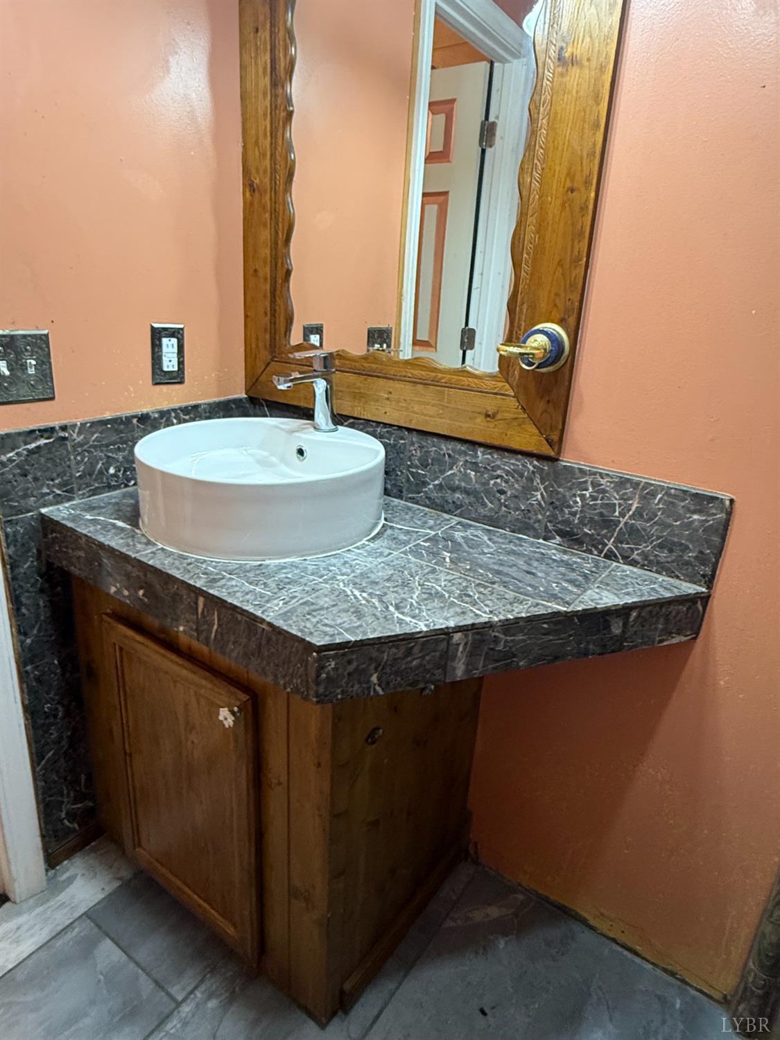 3974 Germantown Road Keysville, VA 23947 - Photo 20 of 42 a bathroom with a granite countertop sink and a mirror