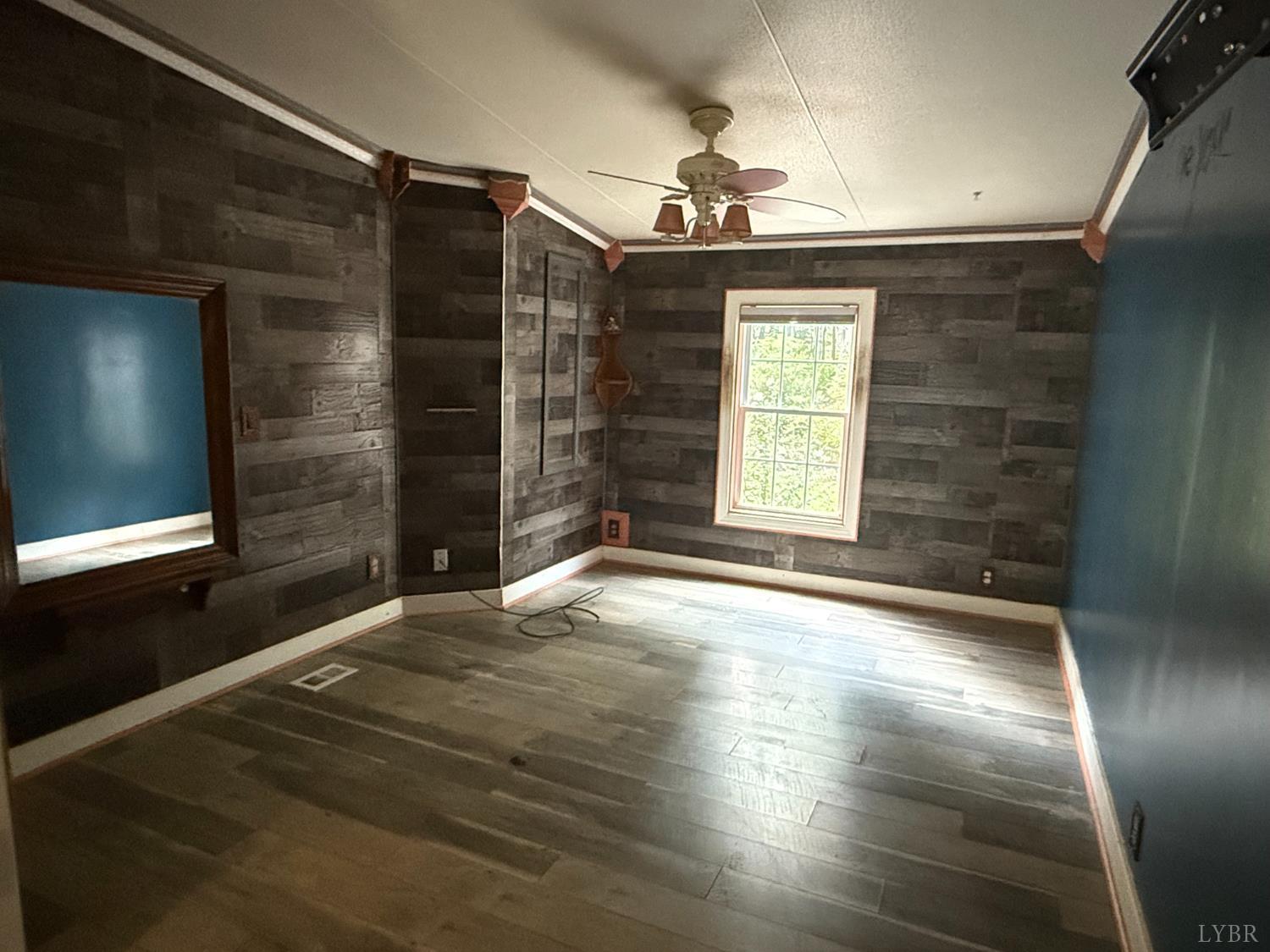 3974 Germantown Road Keysville, VA 23947 - Photo 22 of 42 a view of an empty room with window and wooden floor