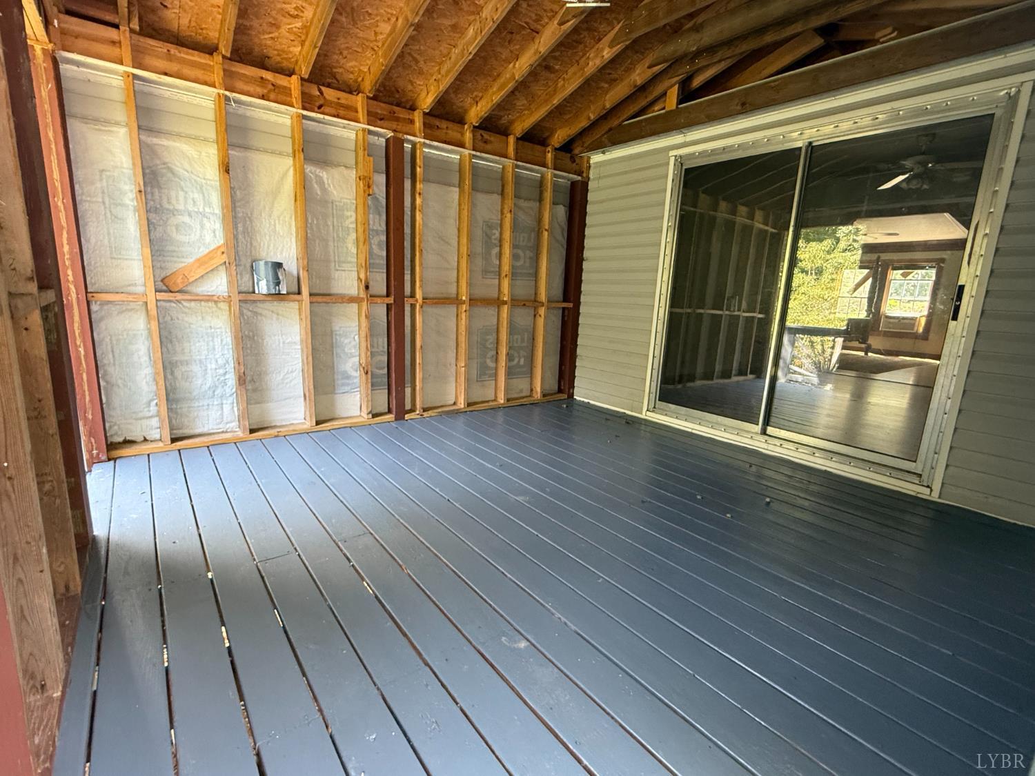 3974 Germantown Road Keysville, VA 23947 - Photo 33 of 42 an empty room with wooden floor and door