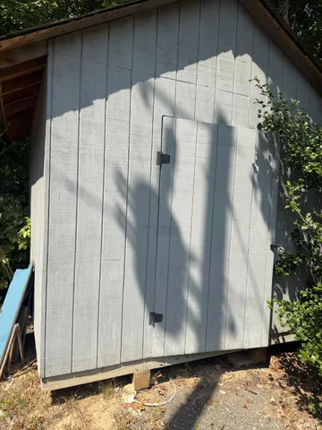 a view of a chair and table on the wooden floor