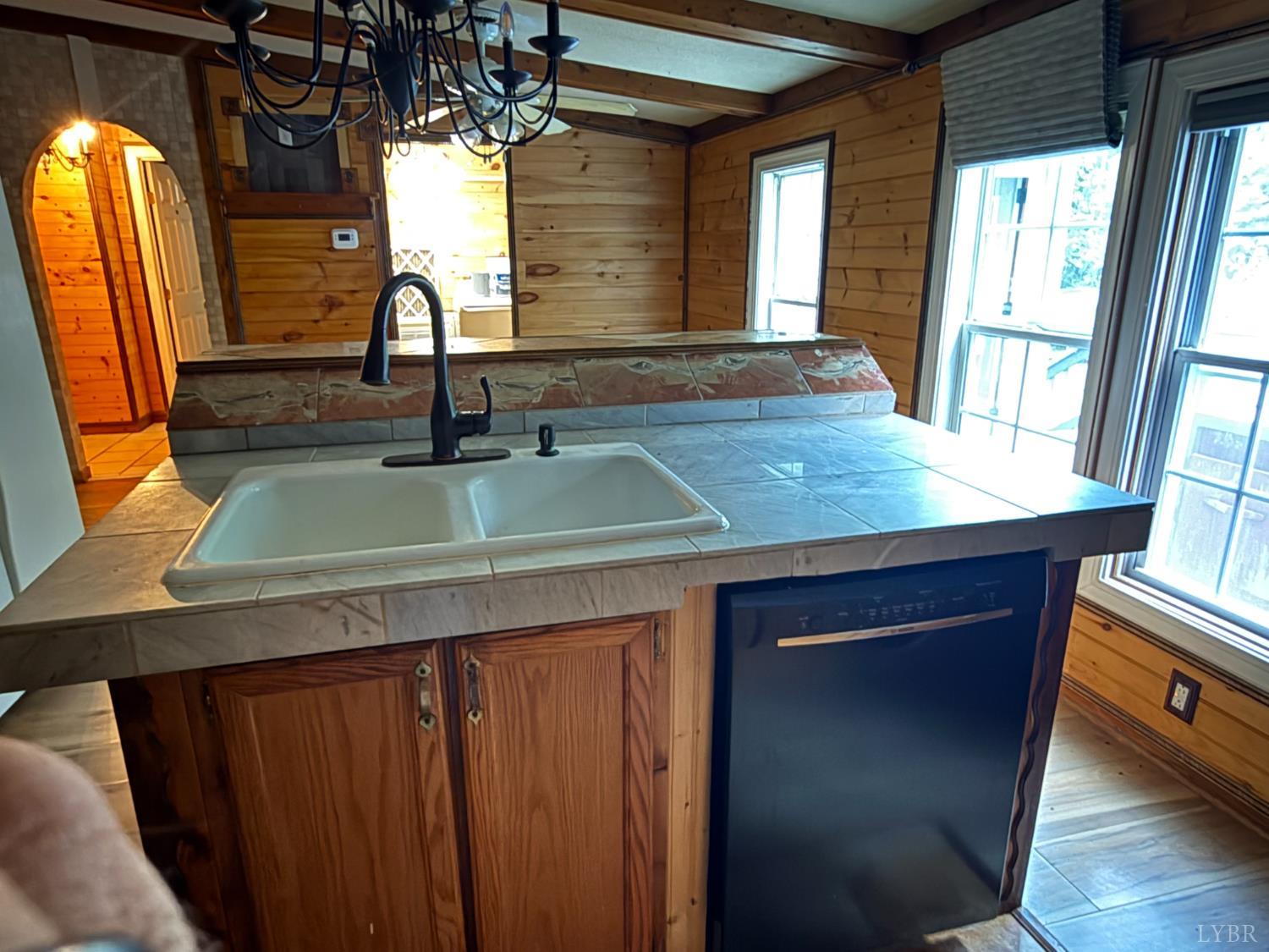 3974 Germantown Road Keysville, VA 23947 - Photo 5 of 42 a view of a kitchen with a sink and a large window
