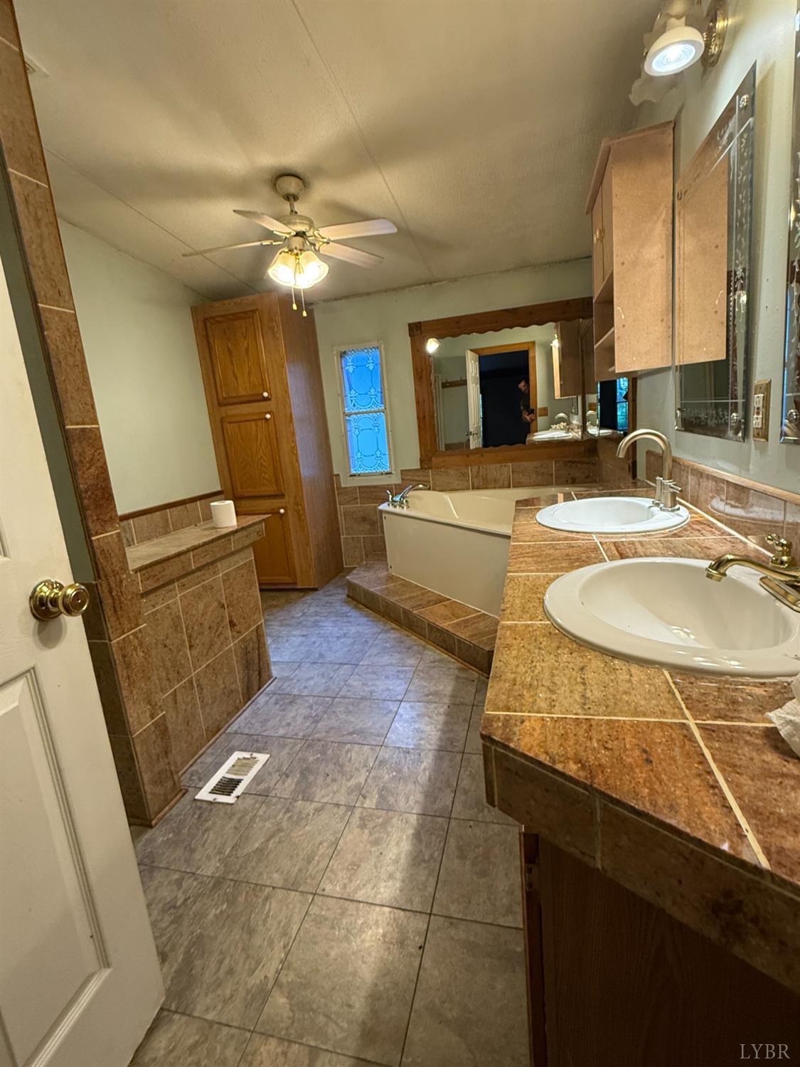 3974 Germantown Road Keysville, VA 23947 - Photo 9 of 42 a bathroom with a sink and a mirror