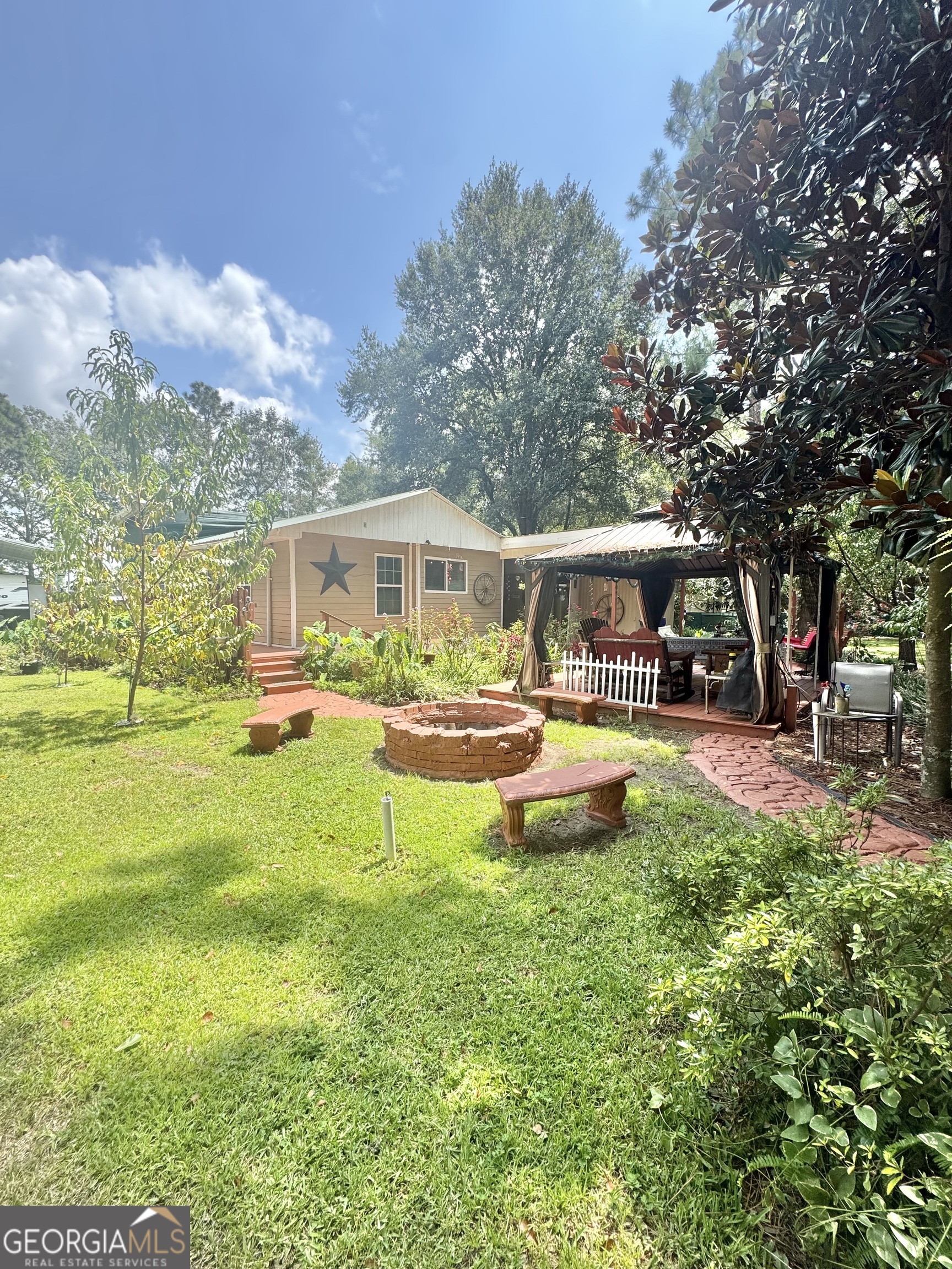 a view of a house with swimming pool and a yard