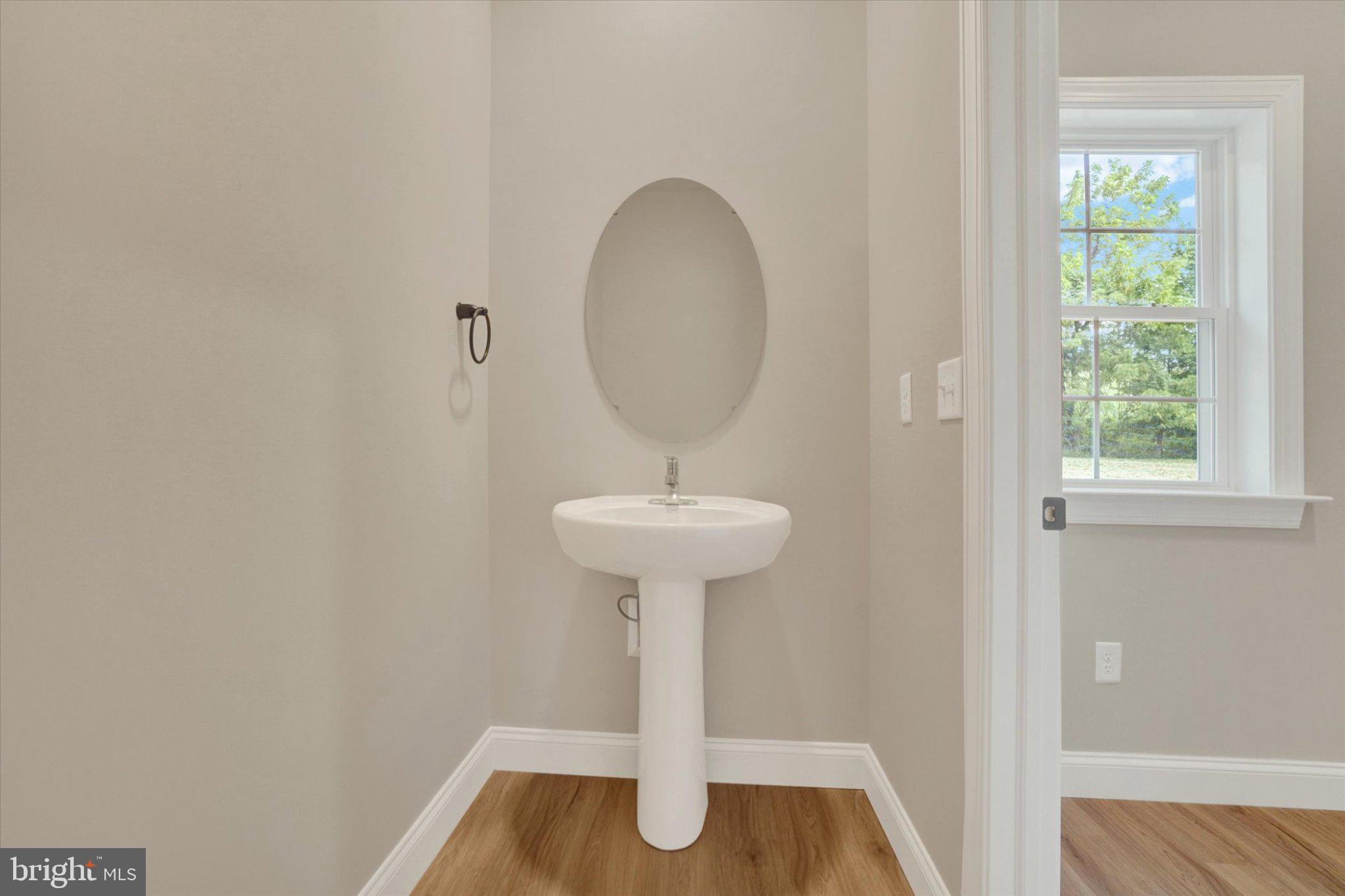 825 Furnace Road York, PA 17406 - Photo 16 of 37 Sleek powder room with natural light.