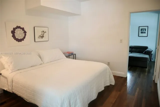 a bedroom with a bed and a couch