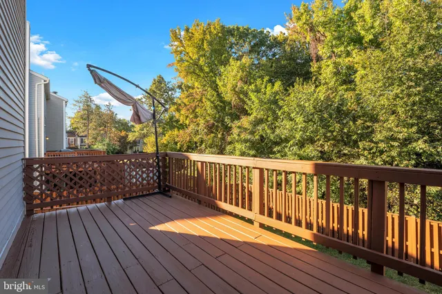 a view of balcony with wooden floor
