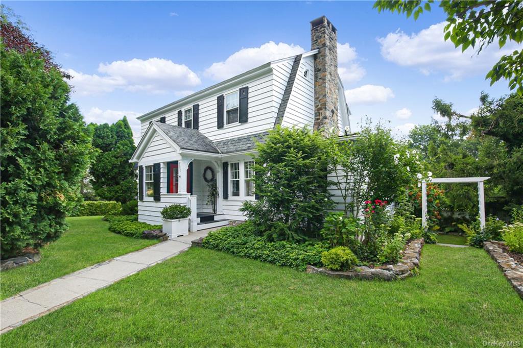 100 Edgemont Road Katonah, NY 10536 - Photo 1 of 1 a front view of a house with a yard and porch