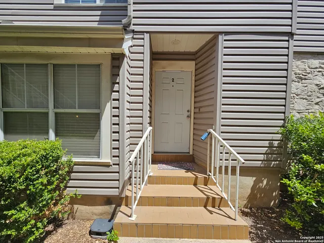 a view of a entryway door front of house
