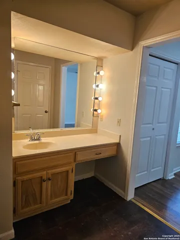 a bathroom with a sink and a mirror