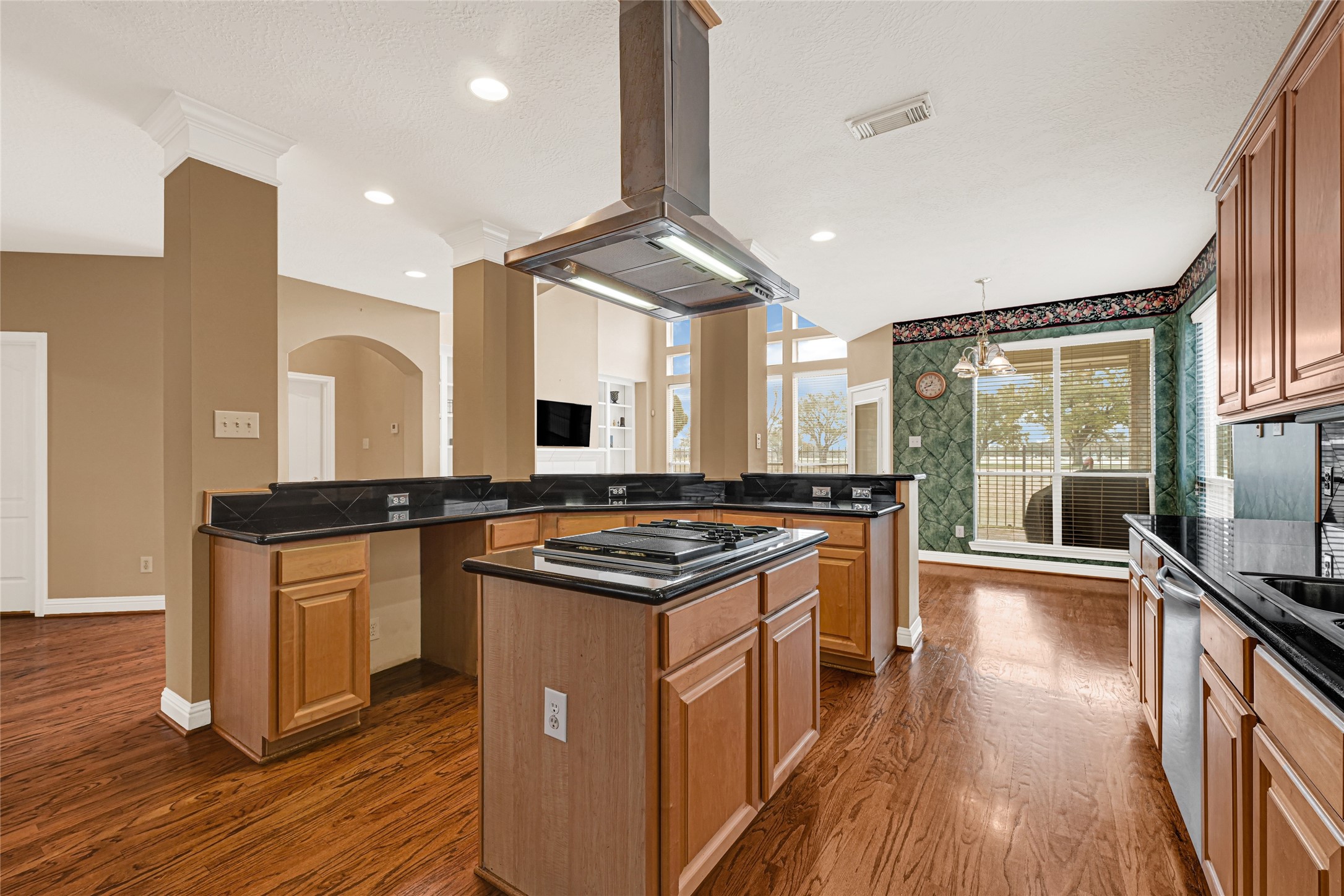 35 Parkway Place Houston, TX 77040 - Photo 11 of 37 a kitchen with stainless steel appliances granite countertop a stove and a wooden floors