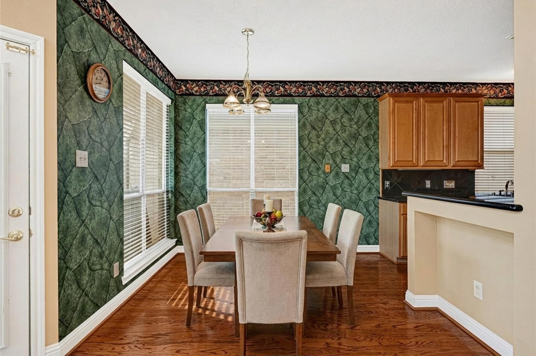 35 Parkway Place Houston, TX 77040 - Photo 12 of 37 a dining room with furniture and wooden floor
