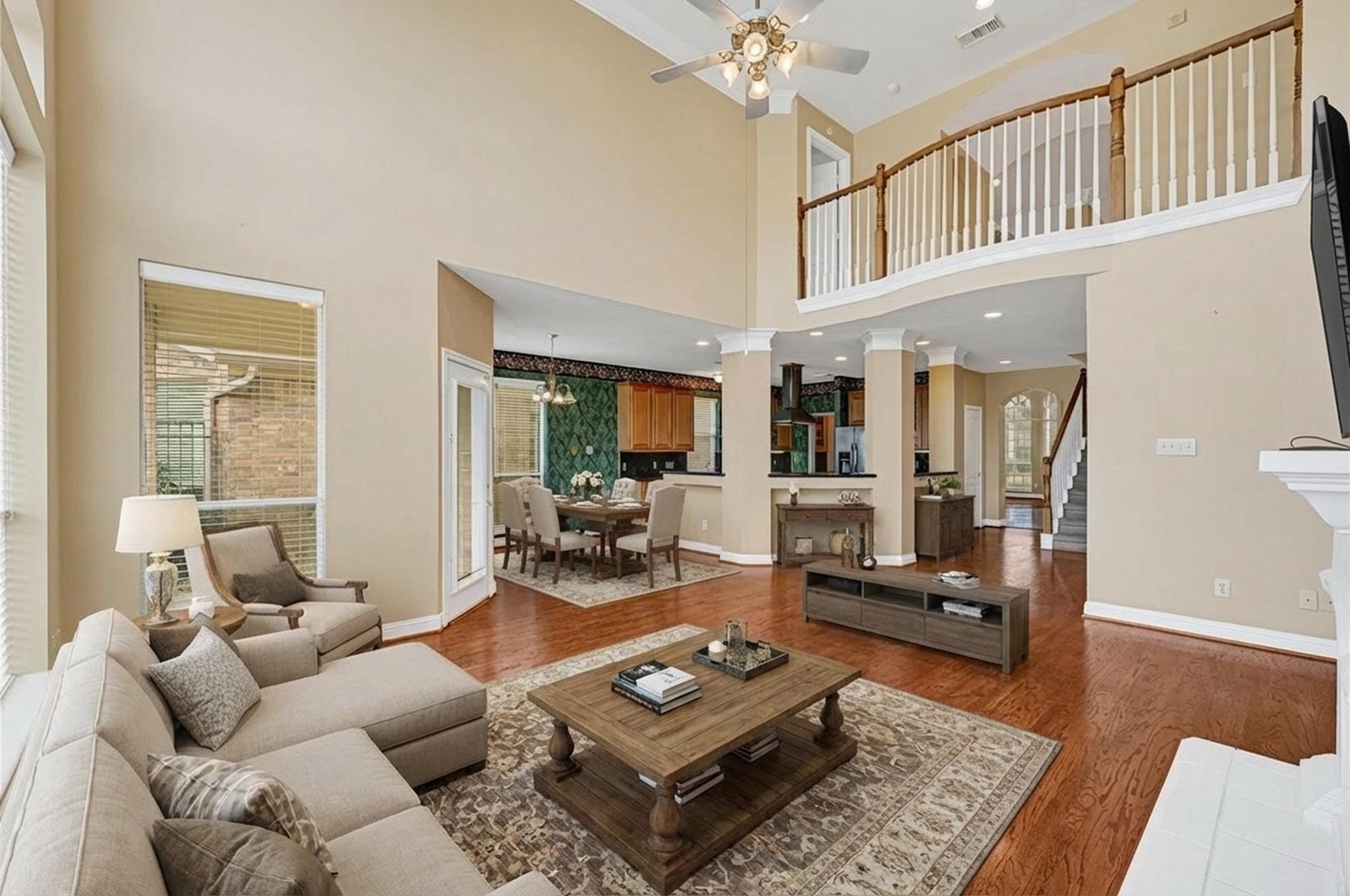 35 Parkway Place Houston, TX 77040 - Photo 16 of 37 a living room with furniture and a wooden floor