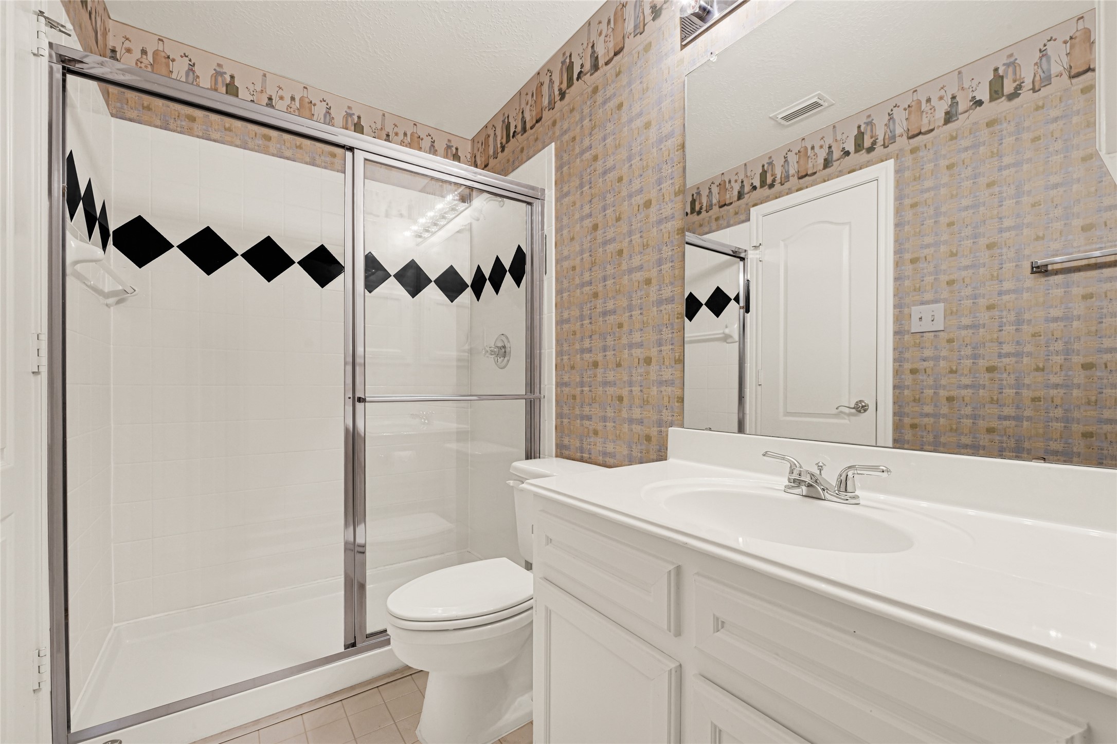 35 Parkway Place Houston, TX 77040 - Photo 33 of 37 a bathroom with a sink a toilet and shower