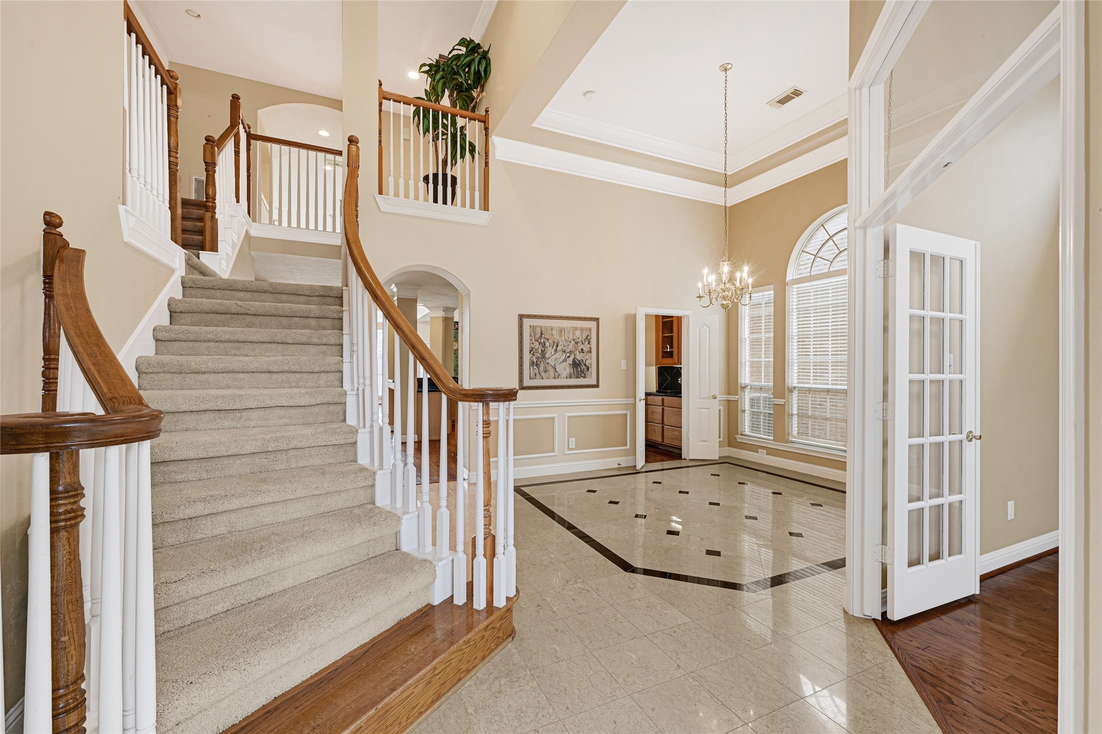 35 Parkway Place Houston, TX 77040 - Photo 4 of 37 a view of a hallway with wooden floor and staircase