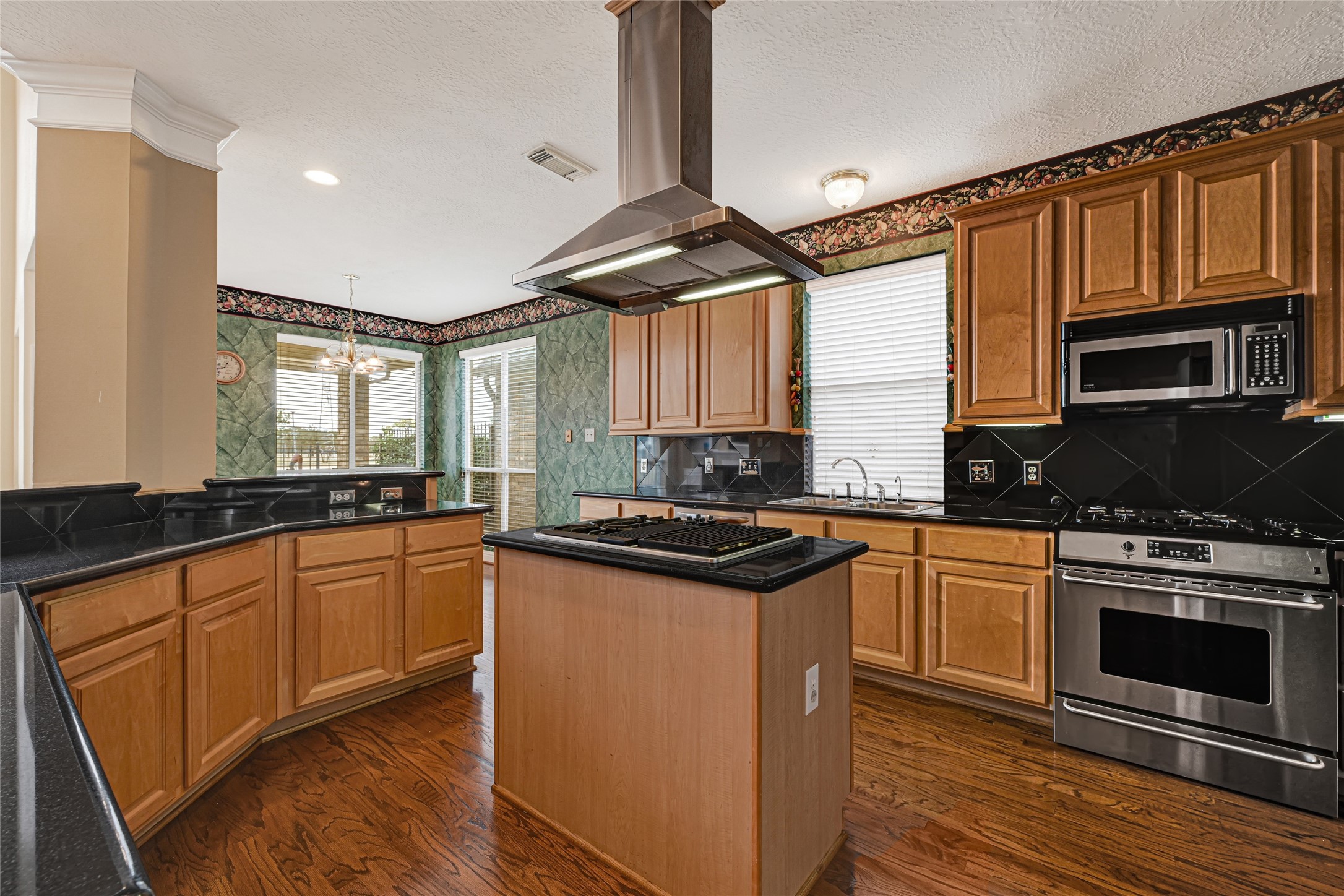 35 Parkway Place Houston, TX 77040 - Photo 9 of 37 a kitchen with stainless steel appliances granite countertop a stove and a sink